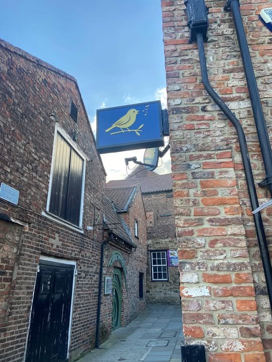Theatre Yard alleyway with The Songbird hanging sign